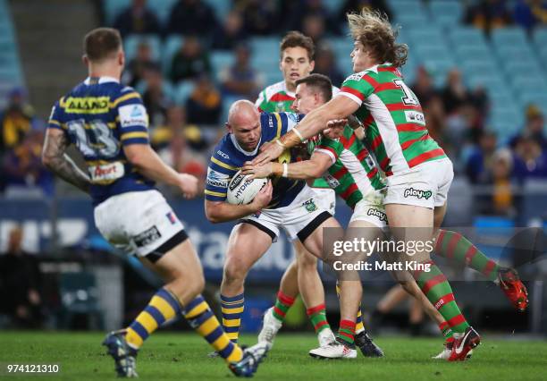 David Gower of the Eels is tackled during the round 15 NRL match between the Parramatta Eels and the South Sydney Rabbitohs at ANZ Stadium on June...