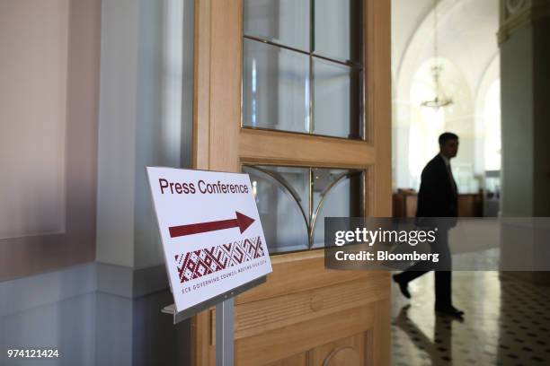 Sign indicates the press conference room location ahead of the European Central Bank rate decision in the Latvian central bank, also known as...