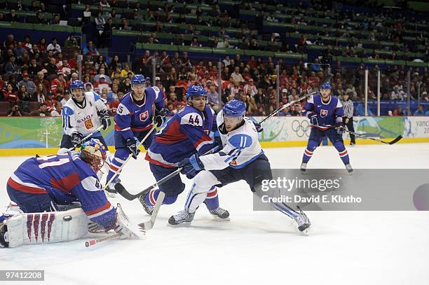 Winter Olympics: Finland Saku Koivu in action vs Slovakia Andrej Sekera and goalie Jaroslav Halak during Men's Bronze Medal Game - Game 29 at Canada...