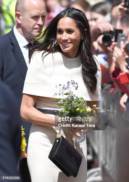 Meghan, Duchess of Sussex smiles as she arrives at Chester Town Hall, where the Duchess and Queen Elizabeth II will attend lunch as guests of Chester...