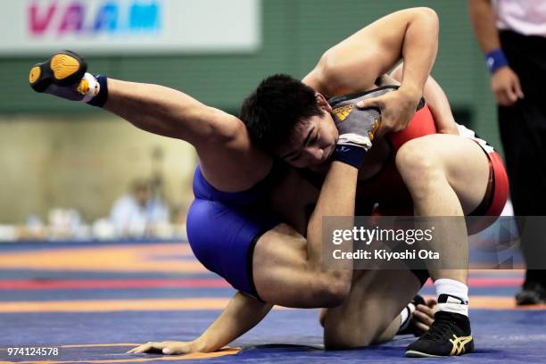 Takashi Ishiguro competes against Keiwan Yoshida in the Men's Freestyle 92kg semifinal match on day one of the All Japan Wrestling Invitational...