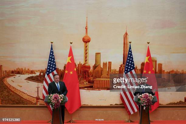 Chinese Foreign Minister Wang Yi speaks during a press conference with U.S. Secretary of State Mike Pompeo at the Great Hall of the People on June...