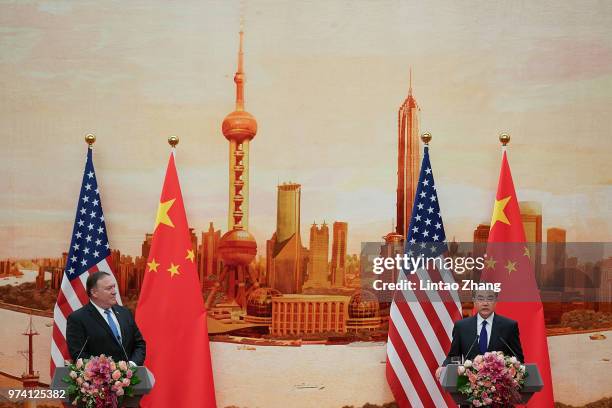 Chinese Foreign Minister Wang Yi speaks during a press conference with U.S. Secretary of State Mike Pompeo at the Great Hall of the People on June...