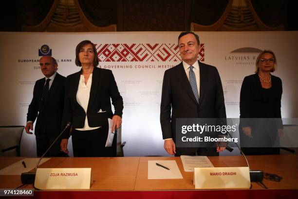 From left to right, Luis de Guindos, vice president of the European Central Bank , Zoja Razmusa, deputy governor of the Bank of Latvia, Mario Draghi,...