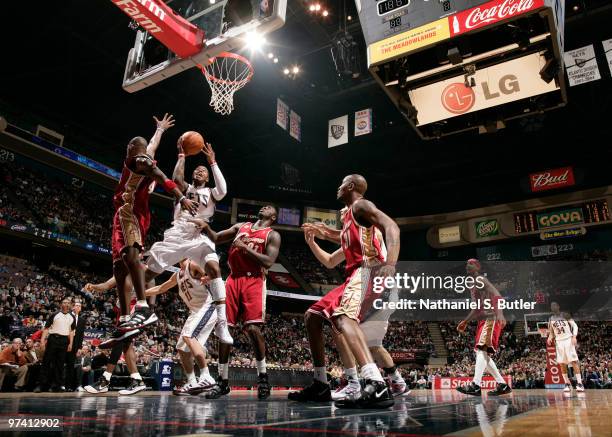 Terrence Williams of the New Jersey Nets shoots against Antawn Jamison of the Cleveland Cavaliers on March 3, 2010 at the IZOD Center in East...