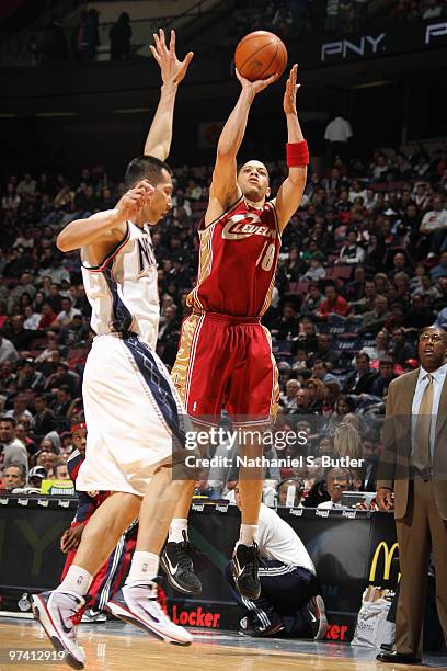 Anthony Parker of the Cleveland Cavaliers shoots against Yi Jianlian of the New Jersey Nets on March 3, 2010 at the IZOD Center in East Rutherford,...