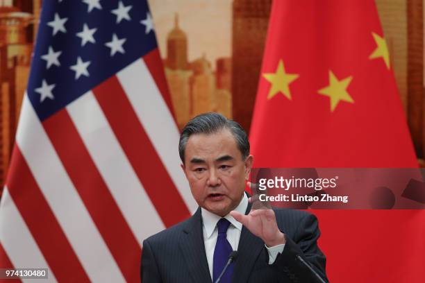 Chinese Foreign Minister Wang Yi speaks during a press conference with U.S. Secretary of State Mike Pompeo at the Great Hall of the People on June...