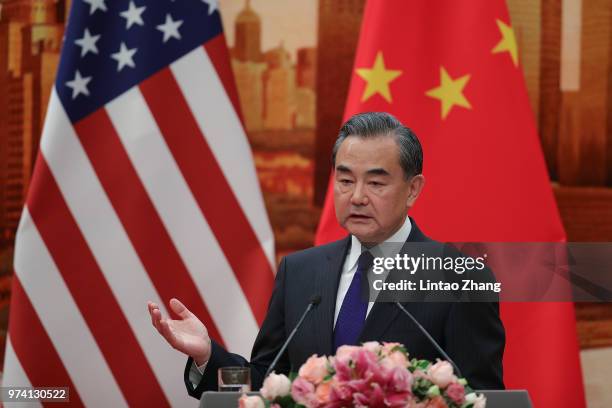 Chinese Foreign Minister Wang Yi speaks during a press conference with U.S. Secretary of State Mike Pompeo at the Great Hall of the People on June...