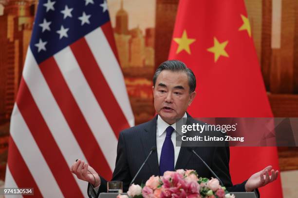 Chinese Foreign Minister Wang Yi speaks during a press conference with U.S. Secretary of State Mike Pompeo at the Great Hall of the People on June...