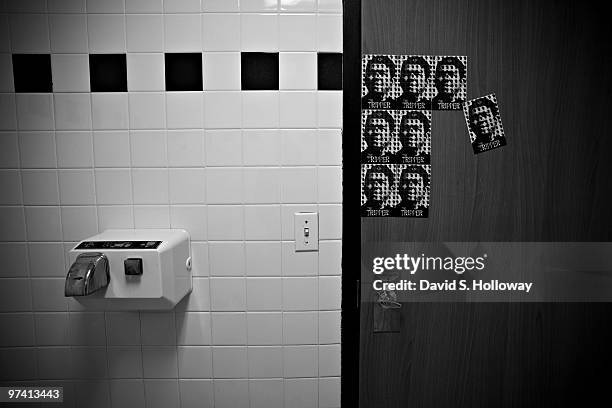 Stickers announcing the "4/20" release date of David Arquette's film "The Tripper" cover a McDonald's restroom door during Day 11 of "The Tripper"...