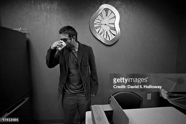 David Arquette gets a boost from a cup of coffee while waiting to go in the broadcast booth to promote his film on The Steve and Vikki in the Morning...