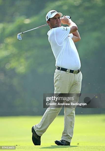 Guido Van Der Valk of The Netherlands plays his second shot on the first hole during the first round of the Maybank Malaysian Open at the Kuala...