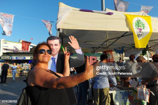 June 8: A Turkish woman takes a selfie with a cardboard cutout of Selahattin Demirtas, leader of the pro-Kurdish opposition People's Democratic Party...