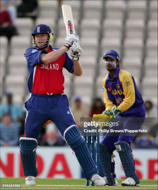 Andrew Flintoff of England hits a boundary during his innings of 104 in the ICC Champions Trophy match between England and Sri Lanka at The Rose...