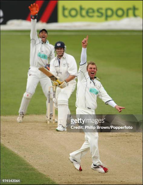 Shane Warne of Hampshire appeals successfully for the wicket of Mark Hardinges of Gloucestershire during the Frizzell County Championship match...