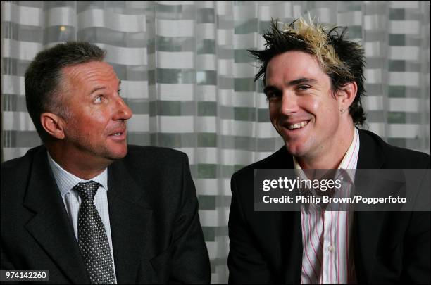 Former England cricketer Ian Botham catches sight of Hampshire and England cricketer Kevin Pietersen's hairstyle during a newspaper interview at the...