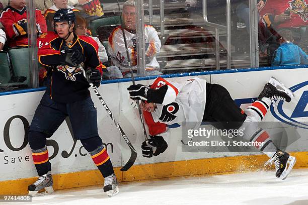 Michael Frolik of the Florida Panthers collides with Dan Carcillo of the Philadelphia Flyers at the BankAtlantic Center on March 3, 2010 in Sunrise,...