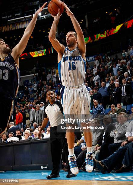 Peja Stojakovic of the New Orleans Hornets shoots over Marc Gasol of the Memphis Grizzlies on March 3, 2010 at the New Orleans Arena in New Orleans,...