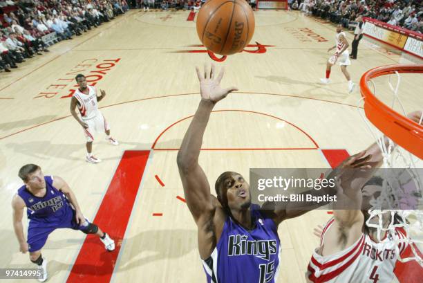 Joey Dorsey of the Sacramento Kings shoots the ball over Luis Scola of the Houston Rockets on March 3, 2010 at the Toyota Center in Houston, Texas....