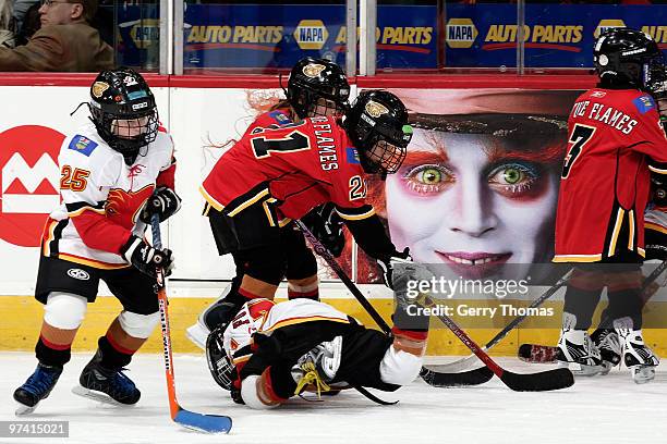 Participants of the Future Flames program skate during the intermission of a game between the Calgary Flames and the Minnesota Wild on March 3, 2010...