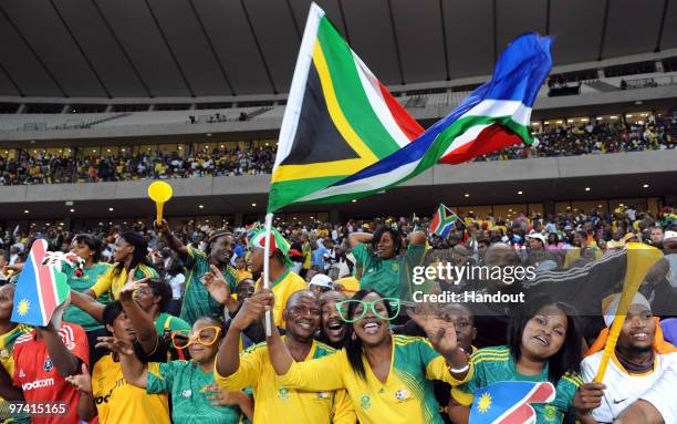 In this handout image provided by the 2010 FIFA World Cup Organising Committee South African fans show their support during the International...