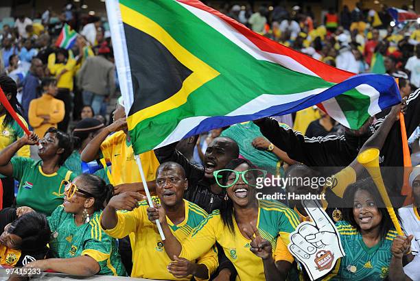 In this handout image provided by the 2010 FIFA World Cup Organising Committee South African fans show their support during the International...