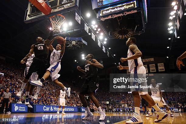 Xavier Henry of the Kansas Jayhawks battles Dominique Sutton of the Kansas State Wildcats for a rebound during the game on March 3, 2010 at Allen...