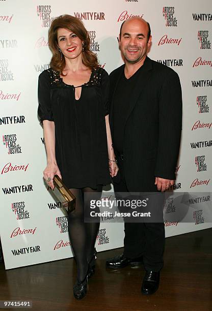 Actress Nia Vardalos and actor Ian Gomez attend Artists for Peace and Justice hosted by Vanity Fair and Brioni held at Bar Nineteen 12 on March 3,...