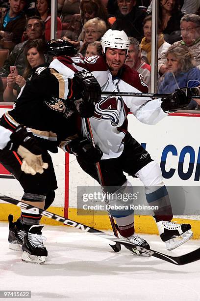 Todd Marchant of the Anaheim Ducks gets tangled up behind the net with Darcy Tucker of the Colorado Avalanche during the game on March 3, 2010 at...