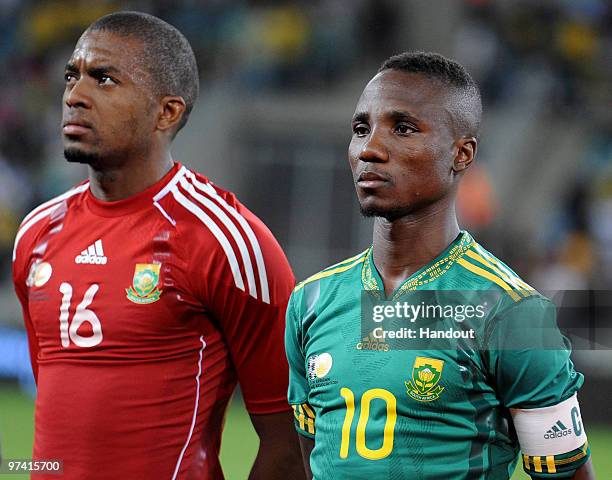 In this handout photo provided by the 2010 FIFA World Cup Organising Committee Teko Modise and Itumelng Khune of South Africa line up before the...