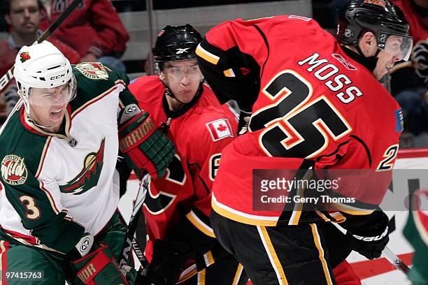 David Moss of the Calgary Flames skates against Marek Zidlicky of the Minnesota Wild on March 3, 2010 at Pengrowth Saddledome in Calgary, Alberta,...