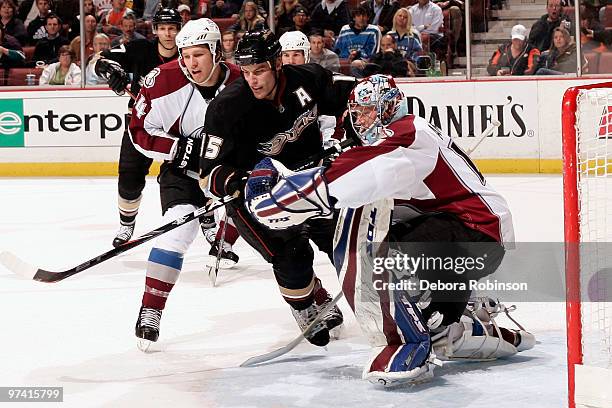 Ryan Getzlaf of the Anaheim Ducks defends outside the crease against John-Michael Liles and Craig Anderson of the Colorado Avalanche during the game...