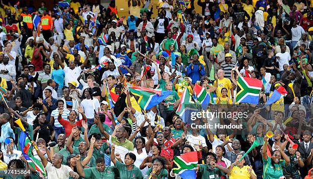 In this handout image provided by the 2010 FIFA World Cup Organising Committee South African fans show their support during the International...