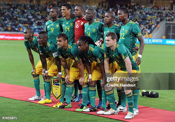 In this handout photo provided by the 2010 FIFA World Cup Organising Committee the South African team line up before the International Friendly match...