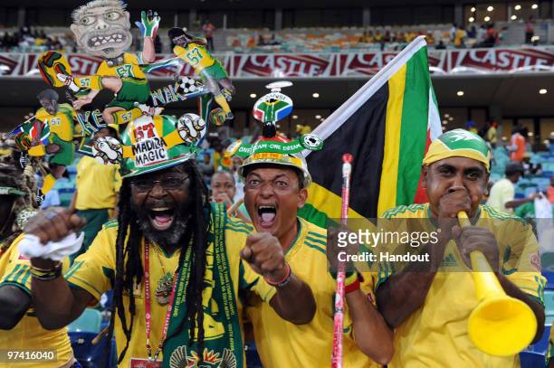 In this handout photo provided by the 2010 FIFA World Cup Organising Committee South African fans show their support during the International...