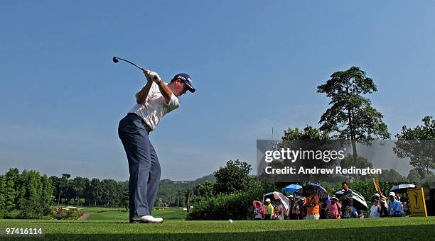 David Howell of England hits his tee-shot on the 17th hole during the first round of the Maybank Malaysian Open at the Kuala Lumpur Golf and Country...