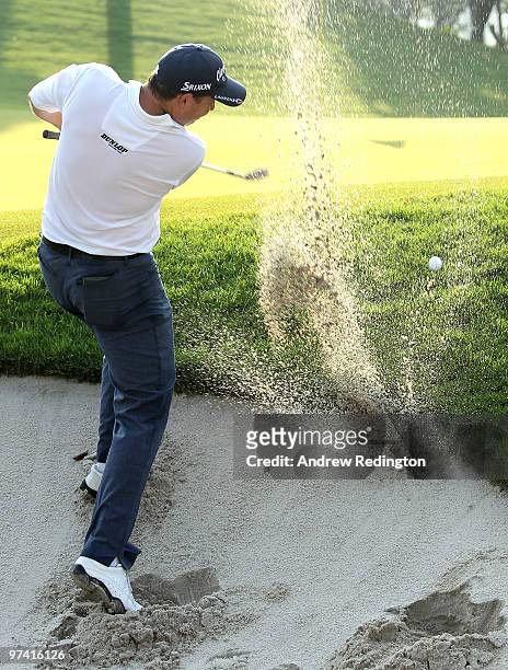 David Howell of England plays from a bunker on the 12th hole during the first round of the Maybank Malaysian Open at the Kuala Lumpur Golf and...