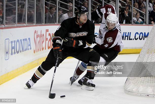 Teemu Selanne of the Anaheim Ducks fends off John-Michael Liles of the Colorado Avalanche in the third period at the Honda Center on March 3, 2010 in...