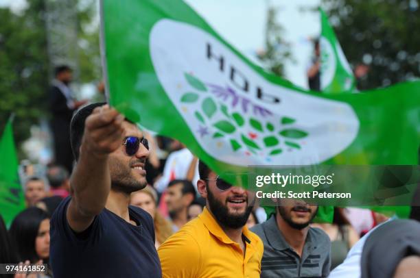 June 10: Under a tight Turkish police presence and behind a police fence, young supporters of the opposition, mainly Kurdish People's Democratic...