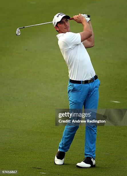 Jamie Elson of England plays his third shot on the tenth hole during the first round of the Maybank Malaysian Open at the Kuala Lumpur Golf and...