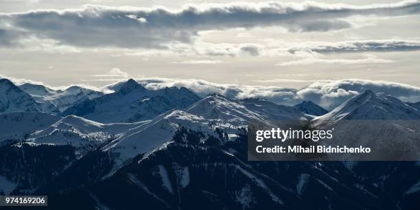 mountain range at sunrise, saalbach, austria - saalbach stock pictures, royalty-free photos & images