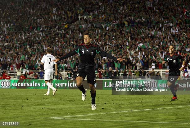 Javier Hernandez of Mexico celebrates his second half goal as Simon Elliott of New Zealand walks to midfield during their International Friendly...