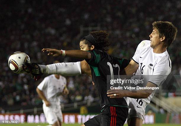 Andrew Boyens of New Zealand defends the pass into the box to Giovani Dos Santos of Mexico in the second half during their International Friendly...