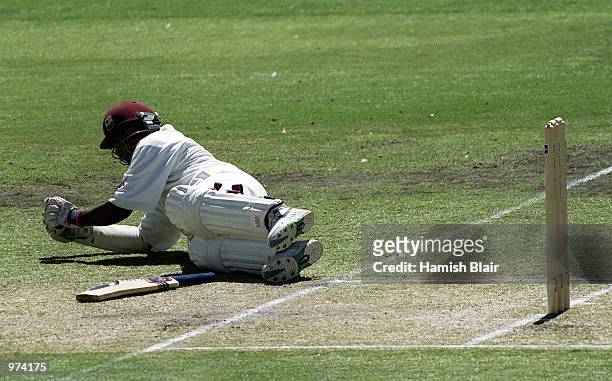Brian Lara of West Indies takes evasive action from a swarm of bees during the second days play of the Third Test match at the Adelaide Oval in...