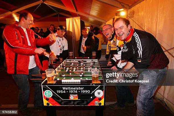 Fans of Germany play table football in the tent of the Fanclub National Team before the International Friendly match between Germany and Argentina at...