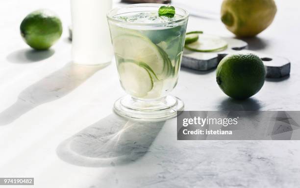 refreshing summer cold drink with shadow of glass - tea glass table bildbanksfoton och bilder