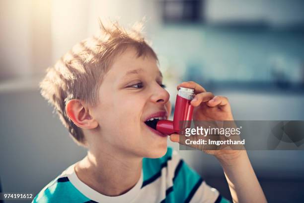 little boy and his asthma inhaler - human lung stock pictures, royalty-free photos & images