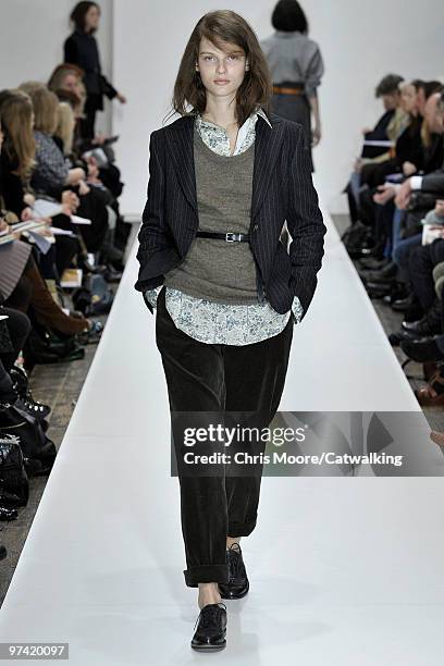 Model walks down the runway during the Margaret Howell fashion show, part of London Fashion Week, London on February 21, 2010 in London, England.