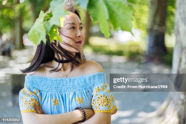 one young lady enjoying sunny summer vacation by boden lake - boden stock pictures, royalty-free photos & images