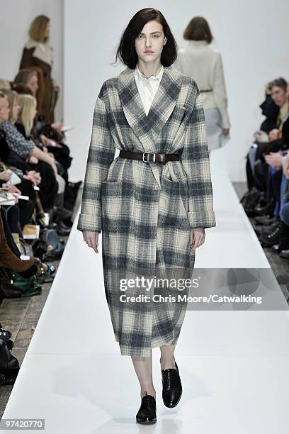 Model walks down the runway during the Margaret Howell fashion show, part of London Fashion Week, London on February 21, 2010 in London, England.